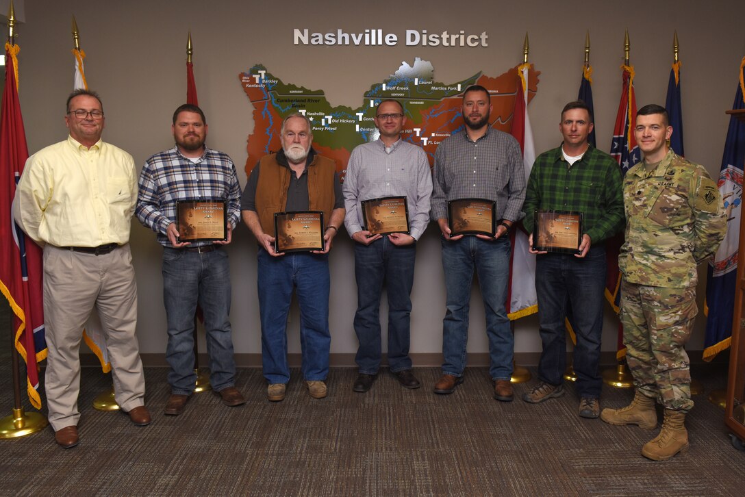 (Left to right) Don Busbice, U.S. Army Corps of Engineers Nashville District Safety chief; James Riley, Wolf Creek Dam Power Plant operator trainee; Robert Williams, Wolf Creek Dam Power Plant shift operator; Anthony Watters, Wolf Creek Dam Power Plant superintendent; Christopher Marlow, Wolf Creek Dam Power Project manager; Eric Todd McGowan, Power Plant maintenance worker, and Lt. Col. Cullen Jones, Nashville District commander; pose in the Nashville District Headquarters Nov. 15, 2018 during a ceremony where the commander presented the team from Wolf Creek Dam with the United States Army Safety Guardian Award.  Jones recognized them on behalf of Brig. Gen. Timothy Daugherty, commanding general of the Combat Readiness Center at Fort Rucker, Ala., for their quick actions to evacuate an injured contractor from a confined space that reduced the time it took for the victim to receive life-saving medical treatment. (USACE photo by Lee Roberts)