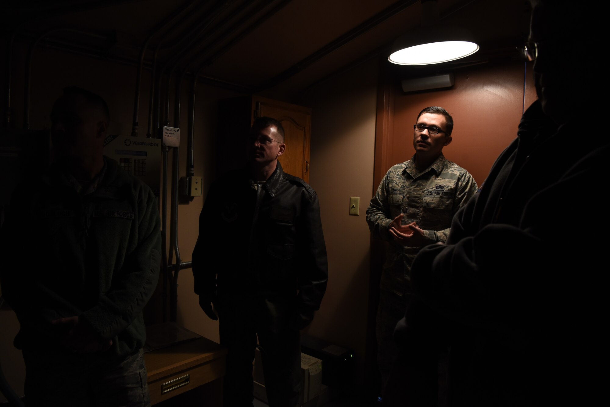 Tech. Sgt. Corey Crim, facility manager, gives 90th Logistic Readiness Squadron Airmen an inside look at his job and the facility he is responsible for maintaining during a tour of a Missile Alert Facility in F.E. Warren Missile Complex, Nov. 8, 2018. The 319th Missile Squadron hosted a group of LRS Airmen to  provide cross-talk between career fields and increase 90th LRS mission role awareness within the ICBM field.. (U.S. Air Force photo by Airman 1st Class Abbigayle Wagner)