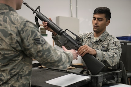 Airman 1st Class Andrew Brewer, 628th Logistics Readiness Squadron apprentice, issues an M-16 during an operational readiness exercise Nov 14, 2018, Joint Base Charleston, S.C. To keep the training as realistic as possible, participants from across JB Charleston received the equipment, weapons and specialty uniform items they would use in real-world situations. The simulated scenarios enabled senior base leaders and subject matter experts to ensure the readiness of JB Charleston’s quick response capabilities.