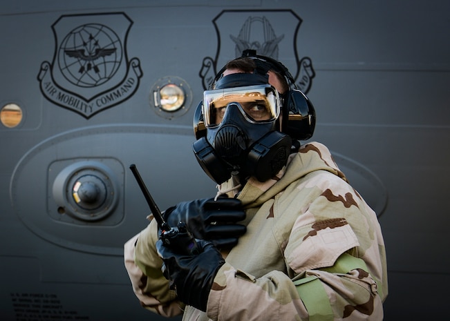 Capt. Christopher Long, 315th Airlift Wing officer in charge of accessories, listens to a radio transmission during a readiness exercise Nov. 16, 2018, at Joint Base Charleston, S.C. To keep the training as realistic as possible, participants from across JB Charleston received the equipment, weapons and specialty uniform items they would use in real-world situations. The simulated scenarios enabled senior base leaders and subject matter experts to ensure the readiness of JB Charleston’s quick response capabilities.