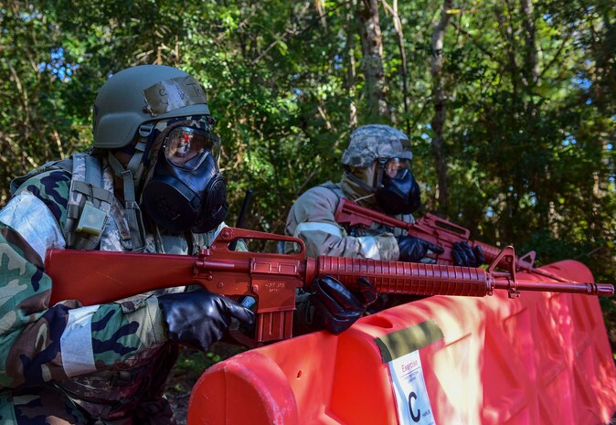 Senior Airman Shanice Truell, left, 315th Security Forces Squadron patrolman, and Senior Airman Vincent Amor, right, 628th Security Forces Squadron patrolman, guard a simulated entry control point during an operational readiness exercise Nov. 16, 2018 at Joint Base Charleston, S.C. To keep the training as realistic as possible, participants from across JB Charleston received the equipment, weapons and specialty uniform items they would use in real-world situations. The simulated scenarios enabled senior base leaders and subject matter experts to ensure the readiness of JB Charleston’s quick response capabilities.