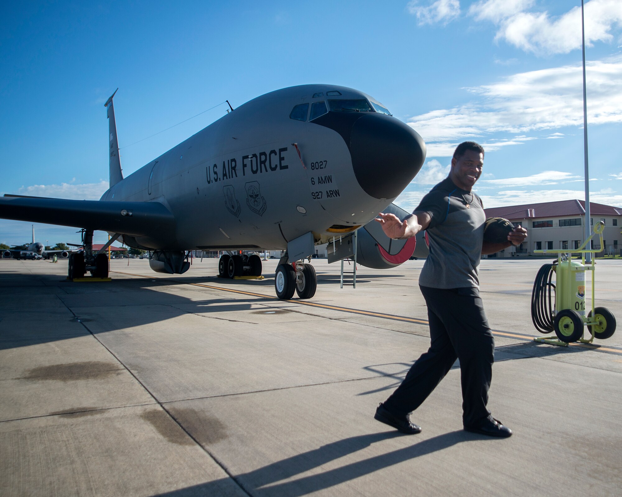 Former NFL running back Herschel Walker pauses for a photo in front of a KC-135 Stratotanker at MacDill Air Force Base, Fla., Nov. 15, 2018.