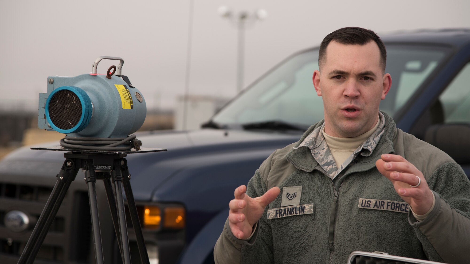 Staff Sgt. Micah Franklin, 92nd Aerospace Medicine Squadron Bio-environmental Engineering craftsman, briefs members of the Spokane Local Emergency Planning Committee on how Team Fairchild hazardous material response teams could deploy a  Radeco high volume air sampler at Fairchild Air Force Base, Washington, Nov. 7, 2018. Emergency response Airmen function much like their civilian counterparts, but are more specialized to handle the specific challenges an air base may face.  (U.S. Air Force Photo/ Senior Airman Ryan Lackey)