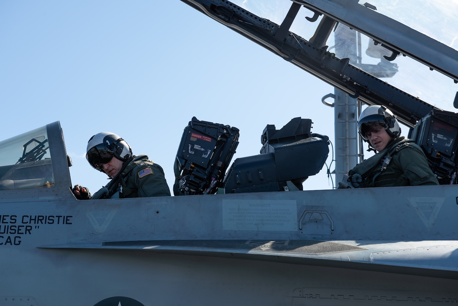 PHILIPPINE SEA (Nov. 16, 2018) Rear Adm. Michael Wettlaufer, commander, Carrier Strike Group (CSG) 3, left, and Capt. Steven Hejmanowski, commander, Carrier Airwing (CVW) 9, prepare for flight operations in an EA-18G Growler, with Electronic Attack Squadron (VAQ) 133, on the flight deck aboard the Nimitz-class aircraft carrier USS John C. Stennis (CVN 74). John C. Stennis is underway and conducting operations in international waters as part of a dual carrier strike force exercise. The U.S. Navy has patrolled the Indo-Pacific region routinely for more than 70 years promoting regional security, stability and prosperity.