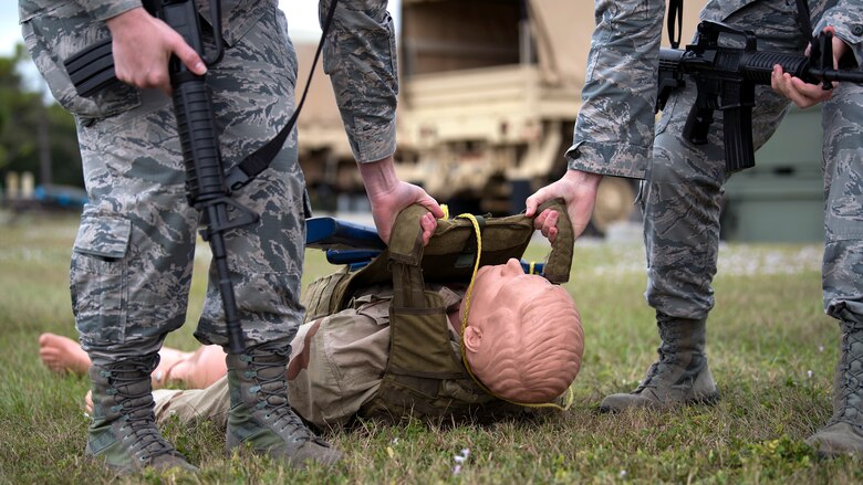 Airmen from MacDill Air Force Base, Fla., drag a medical manikin during a joint-service Tactical Combat Casualty Care course Nov 14-16, 2018. TCCC is designed to reduce preventable combat deaths by teaching life-saving trauma care techniques used on the battlefield.