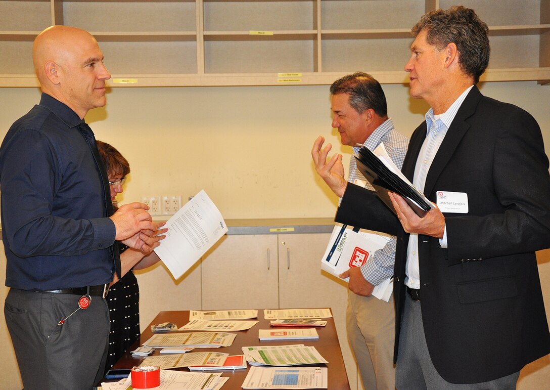 Representatives with the U.S. Army Corps of Engineers Los Angeles District meet with potential business partners during the District’s annual Business Opportunities Open House Nov. 13 at the District’s Headquarters building in downtown Los Angeles. More than 125 business representatives attended the event, seeking opportunities to do work for the Corps.