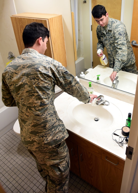 U.S. Air Force Airman 1st Class Jonathan Danzi, a member of Task Force Talon, cleans a dormitory bathroom while at Tyndall Air Force Base, Fla., Nov. 15, 2018. Task Force Talon is responsible for cleaning various parts of Tyndall to include parts of the flightline and the dormitories. Select dormitories will be used to house permanent party Airmen who return to Tyndall. (U.S. Air Force photo by Senior Airman Isaiah J. Soliz)