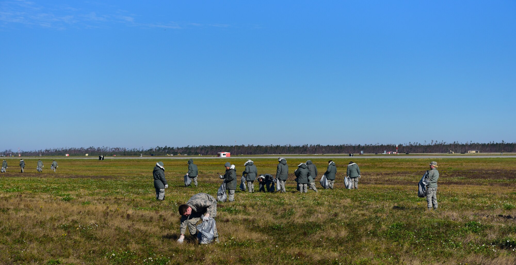 Task Force Talon Airmen clear debris from the areas near the flightline at Tyndall Air Force Base, Fla., Nov. 16, 2018. Members of Task Force Talon are charged with clearing foreign object debris from the Tyndall flightline as well as clearing select dormitories of their contents. (U.S. Air Force photo by Senior Airman Cody R. Miller)