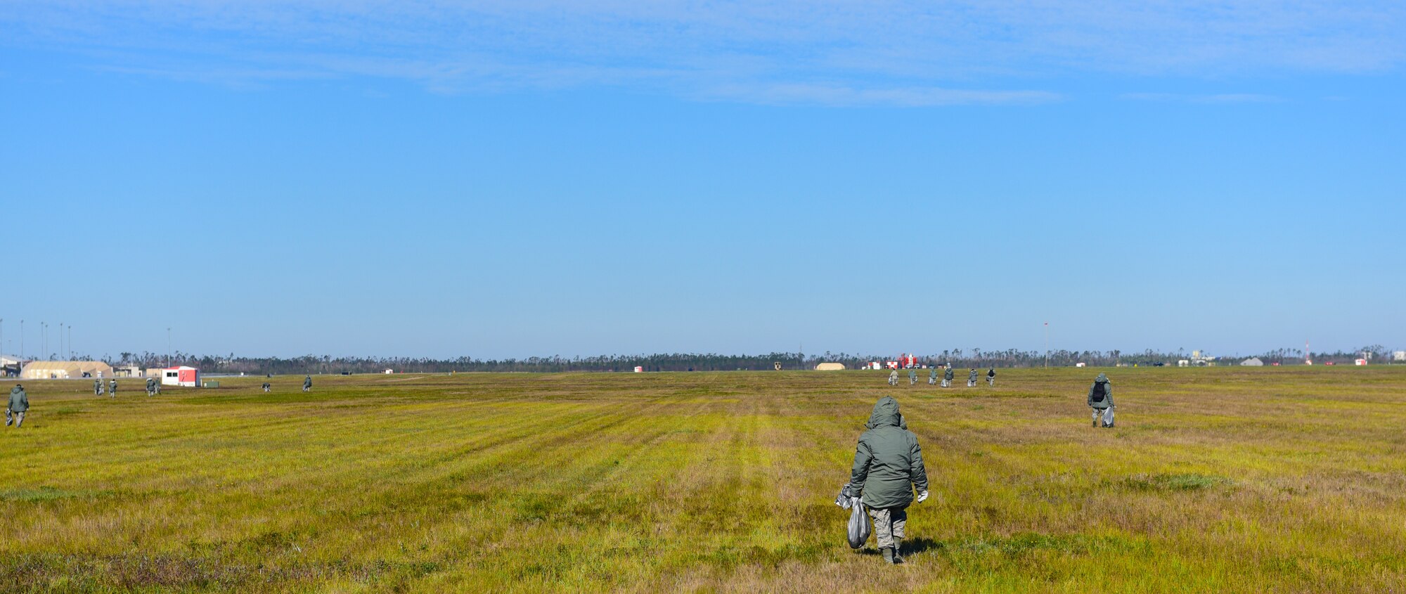 Task Force Talon Airmen clear debris from the areas surrounding the flightline at Tyndall Air Force Base, Fla., Nov. 16, 2018. Task Force Talon Airmen are responsible for clearing debris from various parts of Tyndall to include the flightline and select dormitories. (U.S. Air Force photo by Senior Airman Cody R. Miller)