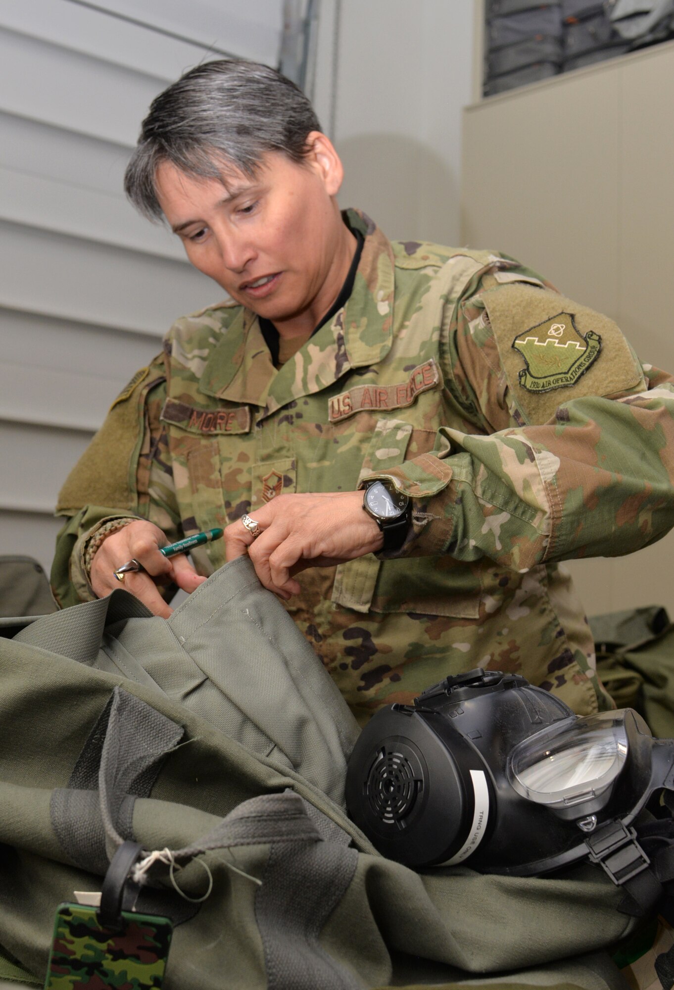 Master Sgt. Kerrie Moore, an airspace manager with the 193rd Combat Operations Squadron, prepares her mobility bag Oct. 19, 2018, in anticipation of another deployment.  Moore earned the title of 2017 Outstanding Senior Non-Commissioned Officer of the Year for the Pennsylvania National Guard. She was also named USO Air Force Servicemember of the Year for the Pennsylvania and Southern New Jersey region. (U.S. Air National Guard photo by 1st Lt. Susan Penning/Released)