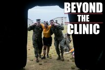 Sailors with 3rd Dental Battalion, 3rd Marine Logistics Group, bring in a notional casualty into a Role II facility for care during triage scenario training Nov. 16, 2018 at Camp Hansen, Okinawa, Japan. Sailors from dental clinics on Okinawa participated in Tactical Casualty Care to reinforce the basics of triage care for personnel involved in combat operations with support from Sailors with 3rd Medical Battalion. The various scenarios were chosen to depict common injuries that are seen during deployments. (U.S. Marine Corps photo by Lance Cpl. Armando Elizalde)