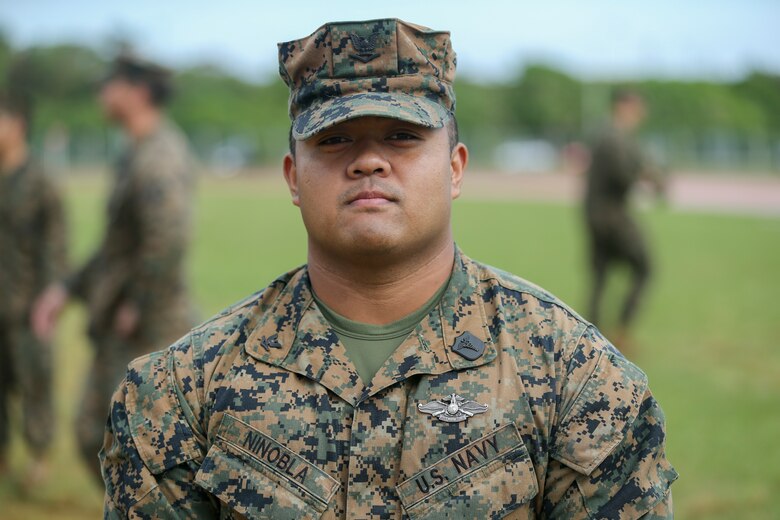 U.S. Navy Hospital Corpsman 3 Alan A. Ninobla III finishes a triage care scenario with fellow Sailors from the Camp Kinser Dental clinic Nov. 16, 2018 on Camp Hansen, Okinawa, Japan. Sailors from dental clinics on Okinawa participated in Tactical Casualty Care to reinforce the basics of triage care for personnel involved in combat operations with support from Sailors with 3rd Medical Battalion. The various scenarios were chosen to depict common injuries that are seen during deployments. Ninobla, a native of Porterville, California, is a corpsman with 3rd Dental Battalion, 3rd Marine Logistics Group. (U.S. Marine Corps photo by Lance Cpl. Armando Elizalde)