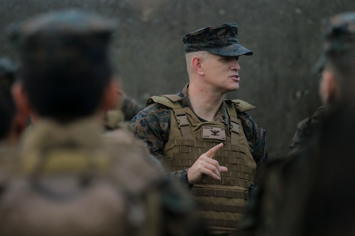 U.S. Navy Capt. David W. Jones speaks with the Sailors of 3rd Dental Battalion, 3rd Marine Logistics Group, following a 3-mile hike Nov. 16, 2018 at Camp Hansen, Okinawa, Japan. 3rd Dental Battalion Sailors participated in a 3-mile conditioning hike to simulate hiking with deployed Marines and traveling to a Role II facility, as well as conducting Tactical Combat Casualty Care upon arrival. Jones, a native of Louisville, Kentucky, is the commanding officer of 3rd Dental Battalion, 3rd MLG. (U.S. Marine Corps photo by Lance Cpl. Armando Elizalde)