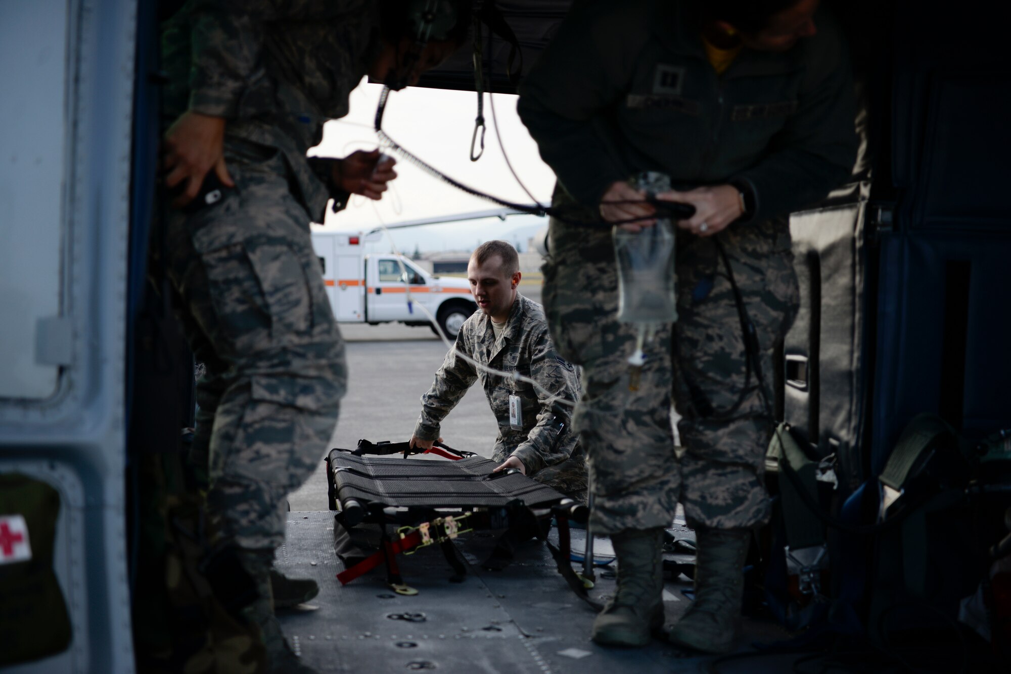 Members of the 374th Medical Group unload medical equipment from a UH-1N Iroquois during training, Nov. 16, 2018, at Yokota Air Base, Japan.