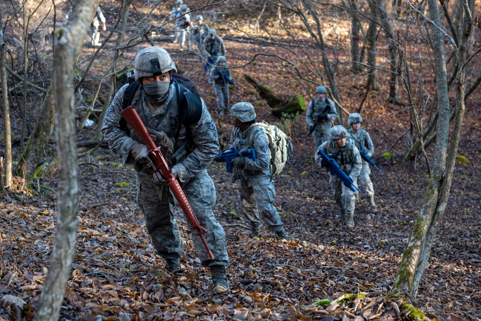 Airmen from the 374th Security Forces Squadron make their way up a hill during a field training exercise at Camp Fuji, Japan, Nov. 8, 2018.