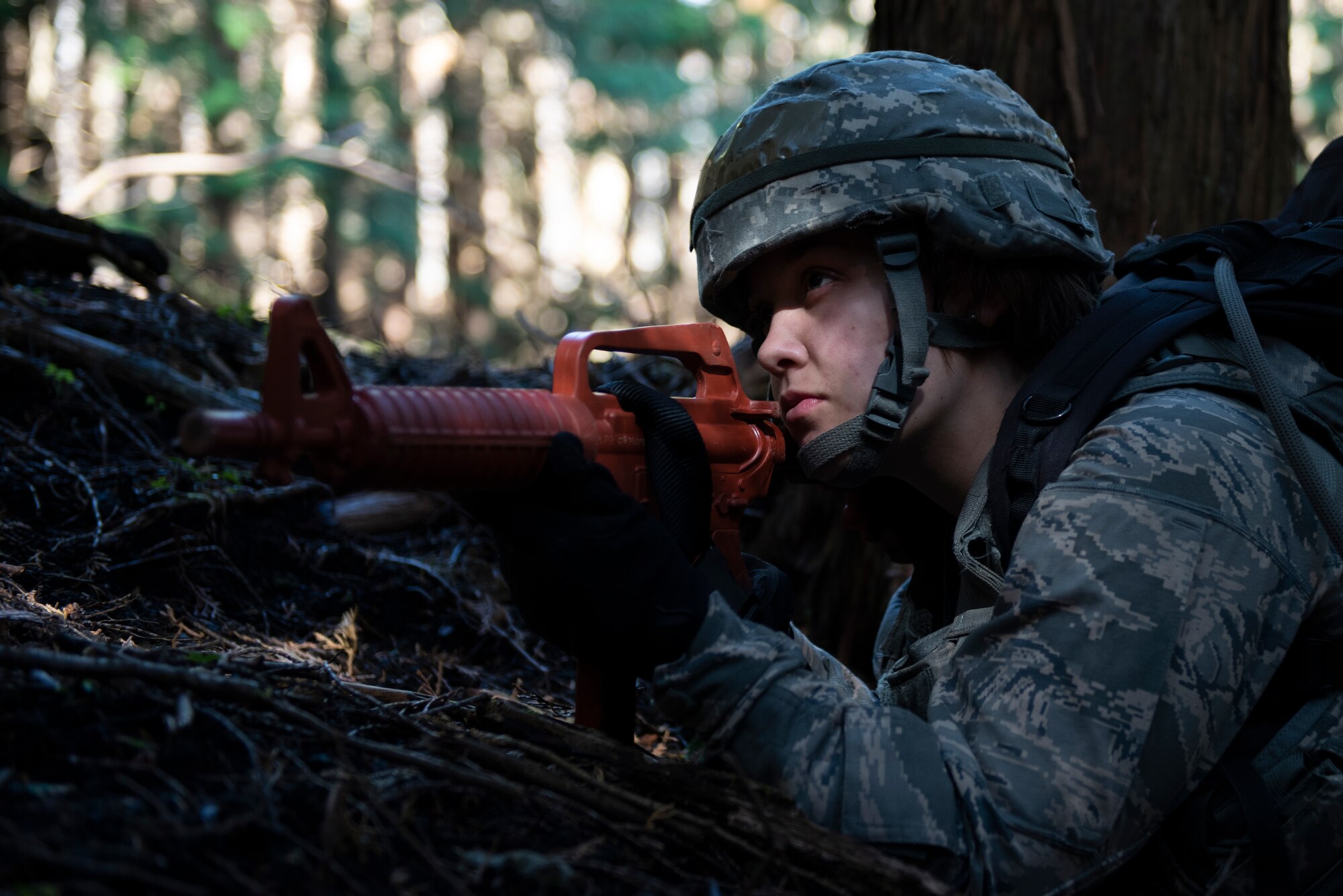 An Airman with the 374th Security Forces Squadron focuses on their area of responsibility for team security during a field training exercise at Yokota Air Base, Japan, Nov. 8, 2018.