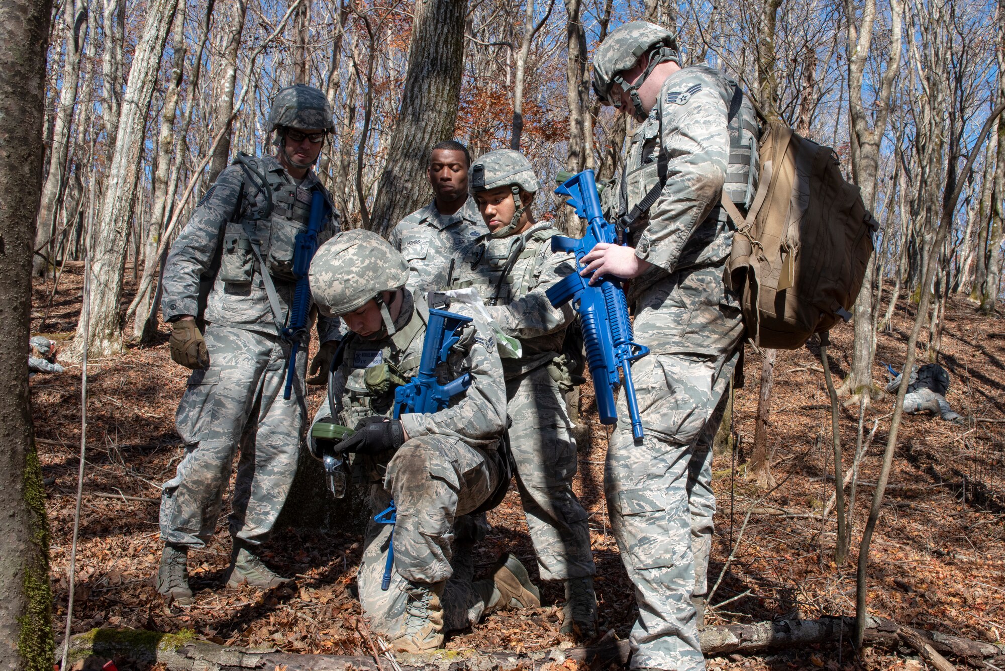 Airmen with the 374th Security Forces Squadron utilize coordinates taken with a Defense Advanced GPS Receiver (DAGR) to plot points on a paper map during a field training exercise at Camp Fuji, Japan, Nov. 8, 2018.