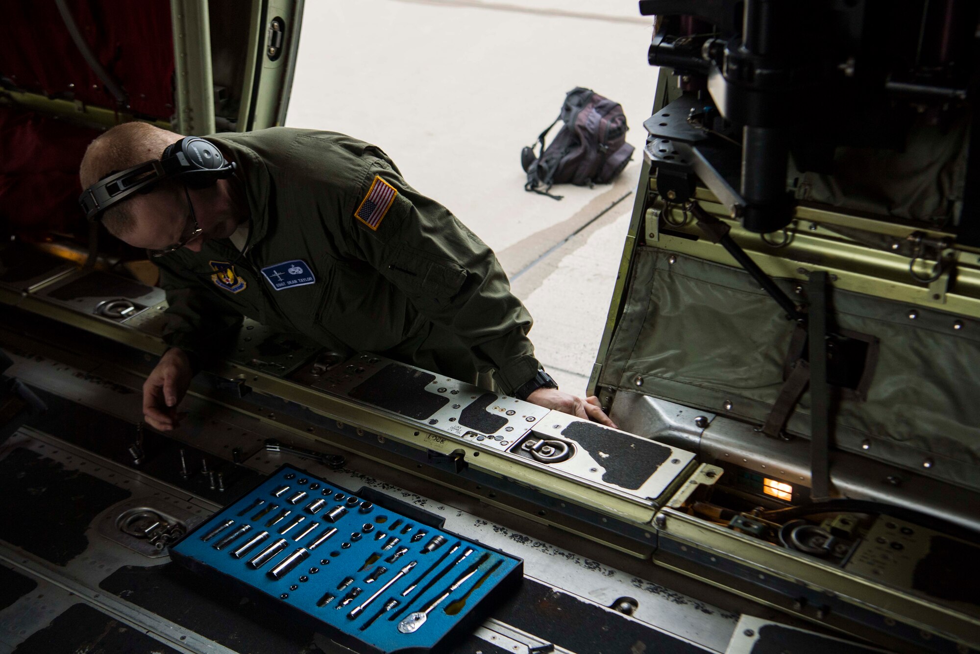 U.S. Air Force Staff Sgt. Sean Taylor, 86th Aircraft Maintenance Squadron flying crew chief works on a C-130J Super Hercules aircraft on Ramstein Air Base, Germany Oct. 31, 2018. Flying crew chiefs ensure the aircraft is taken care of during missions that take place away from home station. (U.S. Air Force photo by Senior Airman Devin M. Rumbaugh)