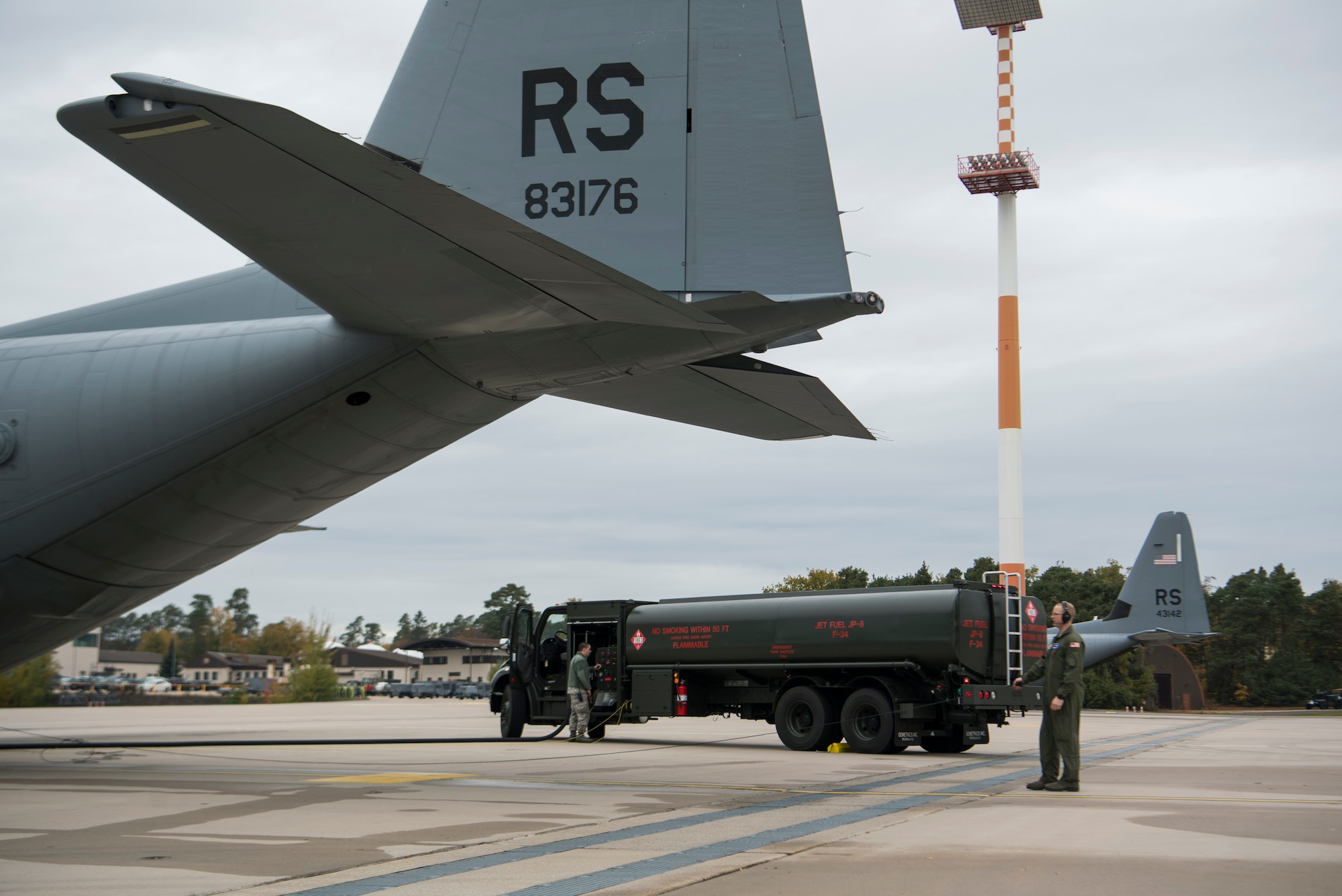 U.S. Air Force Staff Sgt. Sean Taylor, 86th Aircraft Maintenance Squadron flying crew chief, watches as a C-130J Super Hercules aircraft is refueled on Ramstein Air Base, Germany Oct. 31, 2018. Crew chiefs ensure the aircraft is ready for aircrew to accomplish the mission. (U.S. Air Force photo by Senior Airman Devin M. Rumbaugh)