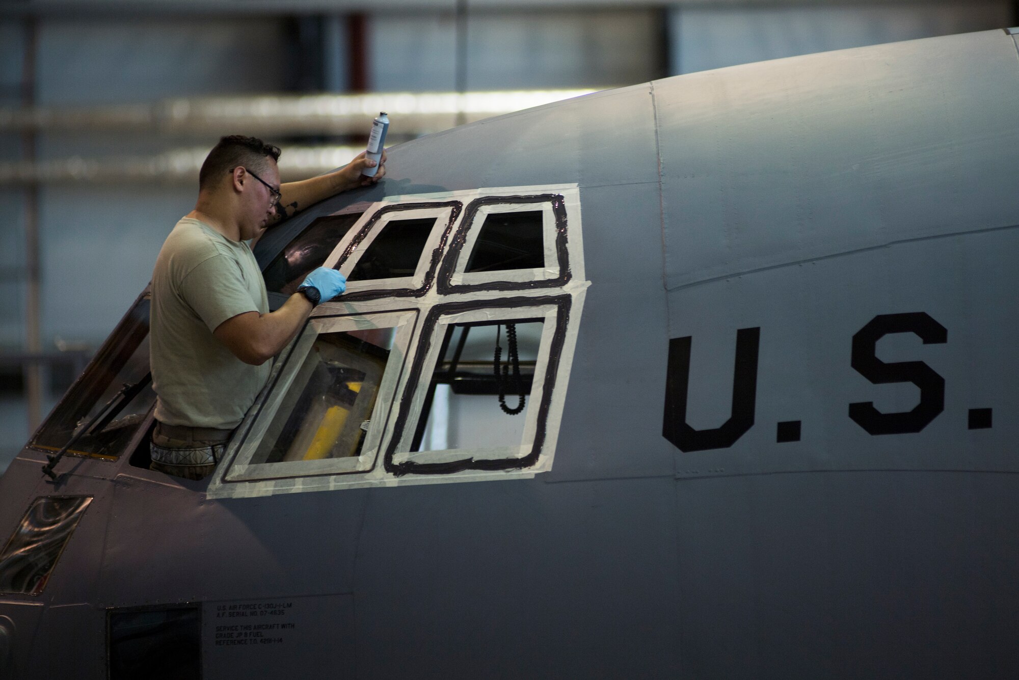 A U.S. Air Force crew chief assigned to the 86th Maintenance Squadron seals a C-130J Super Hercules aircraft window on Ramstein Air Base, Germany, Nov. 6, 2018. Crew chiefs with the 86th MXS ensure aircraft are safe and can be deemed air-worthy. (U.S. Air Force photo by Senior Airman Devin M. Rumbaugh)