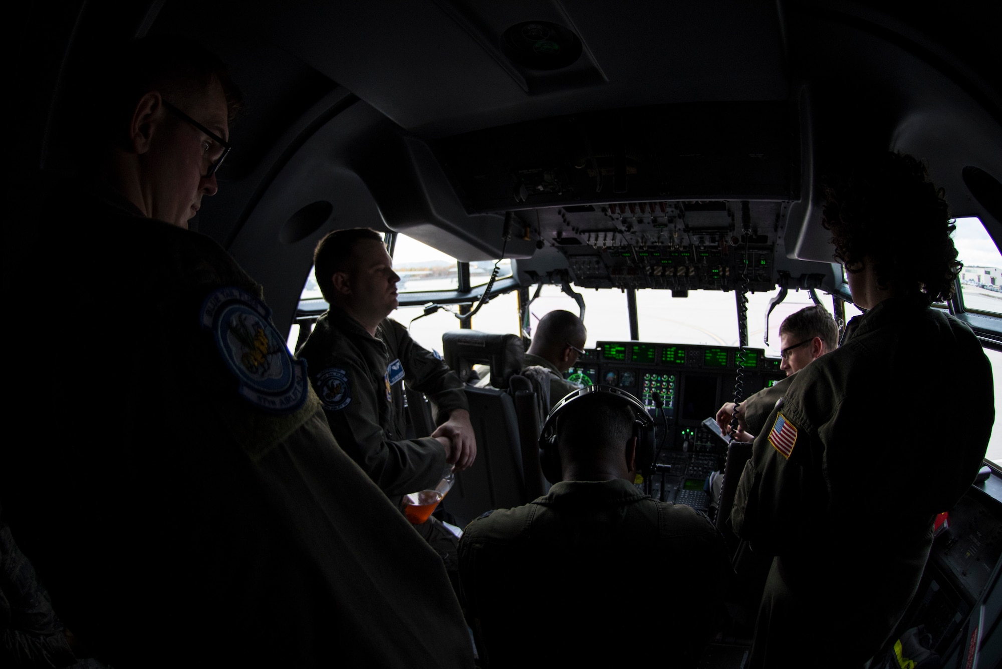 U.S. Airmen assigned to the 37th Airlift Squadron conduct a pre-flight brief on Ramstein Air Base, Germany, Nov. 8, 2018. Pilots and loadmasters work hand in hand to ensure flights are accomplished safely and efficiently. (U.S. Air Force photo by Senior Airman Devin M. Rumbaugh)