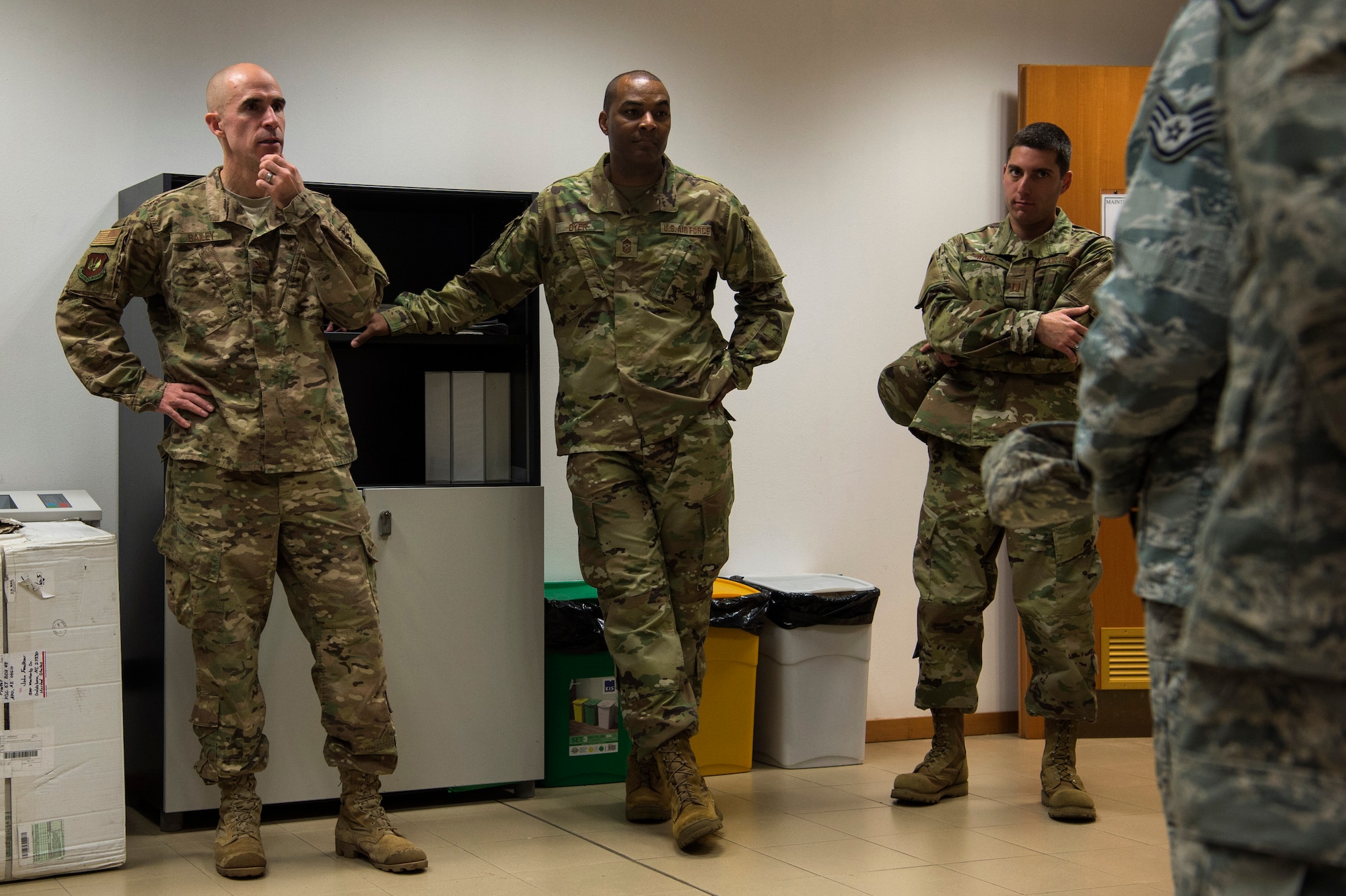 U.S. Air Force Col. Jason Bailey, 52nd Fighter Wing commander, left, and Chief Master Sgt. Alvin Dyer, 52nd FW command chief, center, speak with 704th Munitions Support Squadron maintenance Airmen at Ghedi Air Base, Italy, Nov. 15, 2018. The 704th MUNSS, a 52nd FW geographically separated unit, provides support to the Italian air force, 6th Stormo, supporting surety and deterrence to NATO allies. 52nd FW leadership visited the GSU to recognize and connect with Airmen. (U.S. Air Force photo by Airman 1st Class Valerie Seelye)