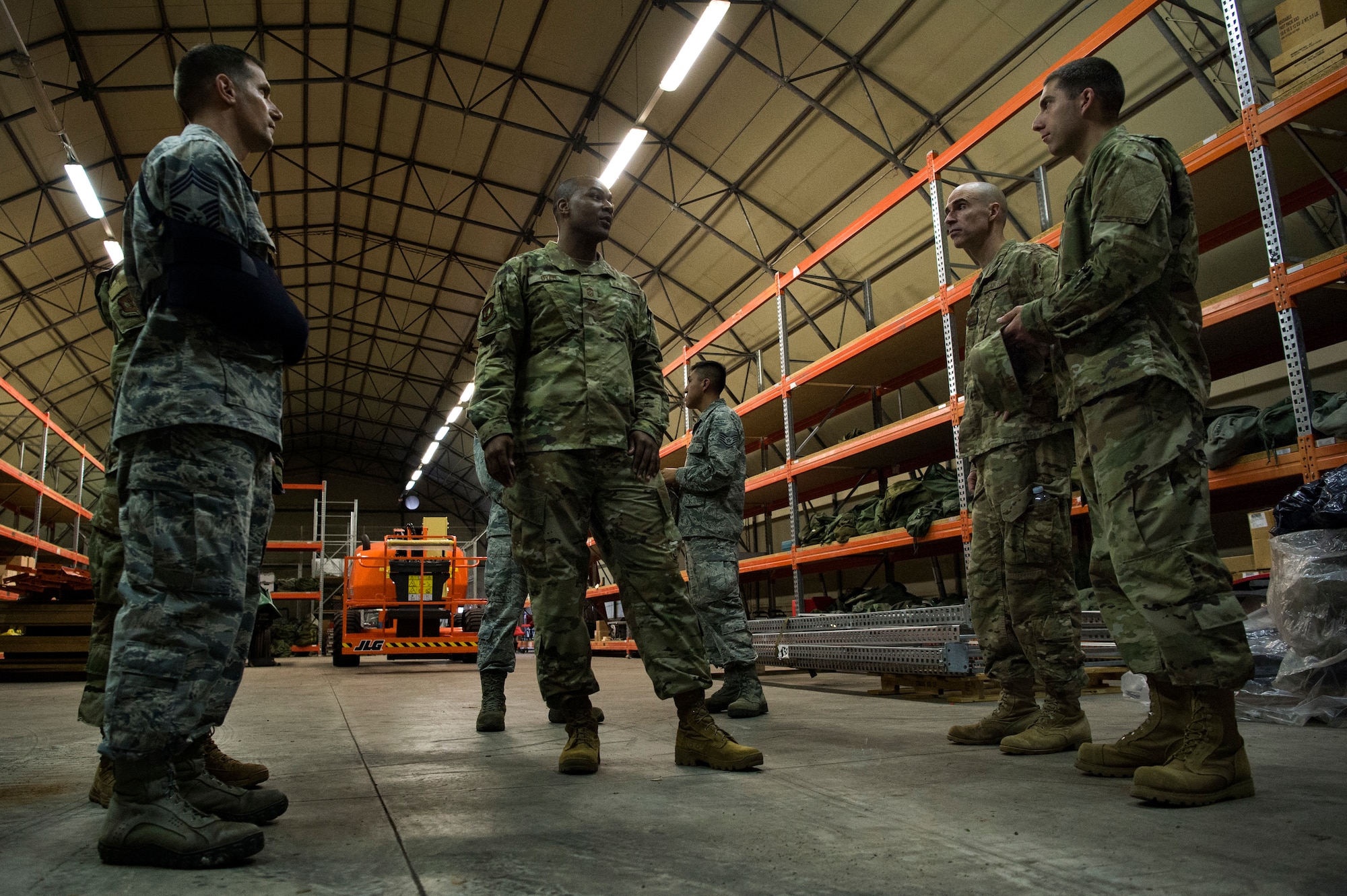 U.S. Air Force Col. Jason Bailey, 52nd Fighter Wing commander, center right, and Chief Master Sgt. Alvin Dyer, 52nd FW command chief, center, tour a supply warehouse at Ghedi Air Base, Italy, Nov. 15, 2018. Spangdahlem Air Base leaders learned how geographically separated Airmen make the mission happen with limited resources. (U.S. Air Force photo by Airman 1st Class Valerie Seelye)