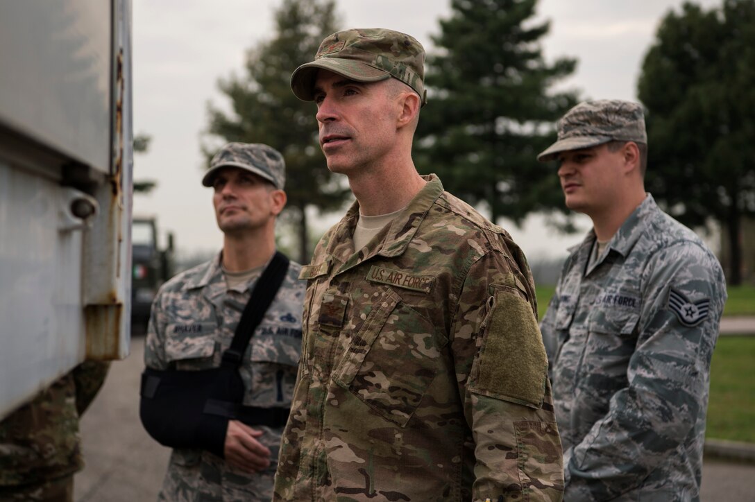 U.S. Air Force Col. Jason Bailey, 52nd Fighter Wing commander, center, Chief Master Sgt. Christopher Shaver, 704th Munitions Support Squadron chief enlisted manager, left, and Staff Sgt. Andrew Redding, 704th MUNSS supply warehouse NCO in-charge, right, view training equipment at Ghedi Air Base, Italy, Nov. 15, 2018. Leadership from Spangdahlem Air Base, Germany, toured the U.S. portion of the Italian air force base, including the dining facility, fitness center, and supply warehouse, for a better understanding of the squadron's operations. (U.S. Air Force photo by Airman 1st Class Valerie Seelye)