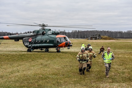 Members of the National Armed Forces of Latvia combined with Airmen from the 110th Attack Wing, Battle Creek Air National Guard Base, Mich., 127th Wing, Selfridge ANG Base, Mich., and Alpena Combat Readiness Training Center, Mich., in an emergency response drill at Lielvārde Air Base, Latvia, Nov. 16, 2018.