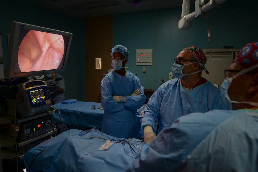 Medical personnel perform abdominal surgery on a patient to repair a hernia in the operating room aboard the hospital ship USNS Comfort (T-AH 20).