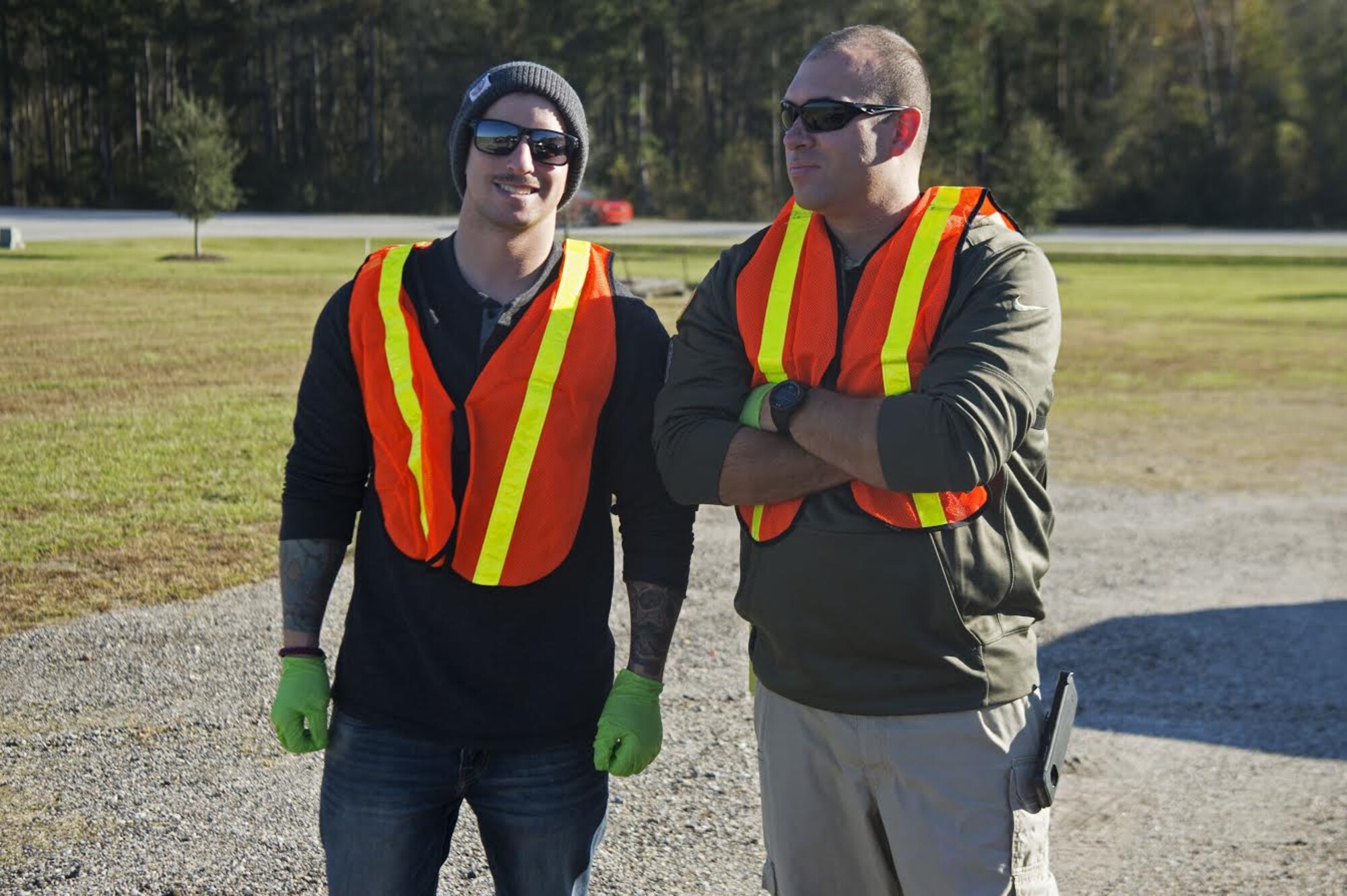 U.S. Air Force Staff Sgt. Patrick Formiller, 20th Security Forces Squadron flight chief, left, and Tech. Sgt. Christopher Ingle, 20th Civil Engineer Squadron non-commissioned officer in charge of emergency communication, right, pose for a photo before starting a highway beautification in Sumter, S.C., Nov. 16, 2018.