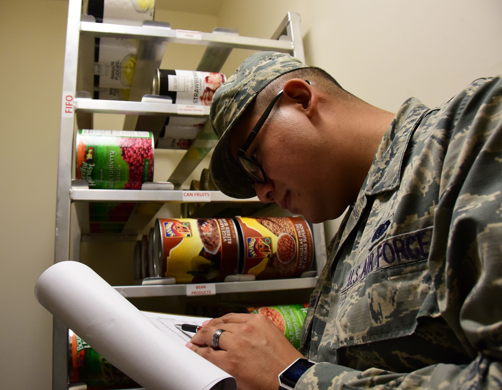 Senior Airman Daniel Gonzalez Hernandez, a services journeyman with the 118th Force Support Squadron, checks inventory in the storeroom on October 14, 2018 at Berry Field Air National Guard Base, Nashville, Tennessee.