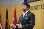 Retired Navy SEAL Jason Redman speaks to the Defense Intelligence Agency workforce Nov. 14, 2018, about the life-changing event in Iraq that made him a wounded warrior and gave him a new perspective on life.
