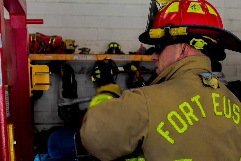 Marco Netzer, Fort Eustis Fire Department lieutenant, conducts refresher training with the Wide-ADZ Pro Bar to forcibly open a door at the Newport News Fire Department in Newport News, Virginia, Nov. 16, 2018. Forced entry is used by firefighters to gain access to a building that is caught on fire or to rescue someone who is trapped. (U.S. Air Force photo by Senior Airman Derek Seifert)