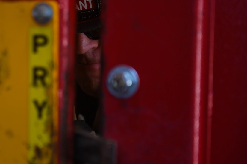 Marco Netzer, Fort Eustis Fire Department lieutenant, pries open a door during forced entry refresher training at the Newport News Fire Department in Newport News, Virginia, Nov. 16, 2018. To forcibly open a locked door, the firefighters used teamwork, communication, strength and the tools available to them. (U.S. Air Force photo by Senior Airman Derek Seifert)