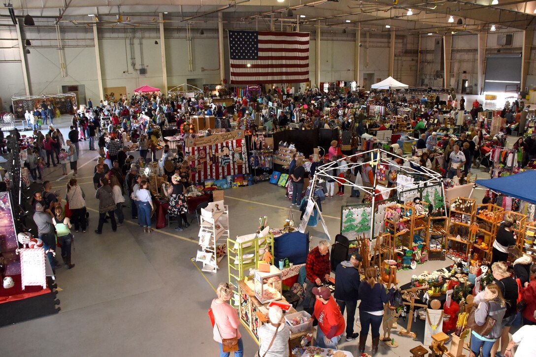 Shoppers at the 38th annual Santa’s Market explore the 78 booths at the Louis F. Garland Department of Defense Fire Academy on Goodfellow Air Force Base, Texas, Nov. 17, 2018. This year, there were many local vendors set up to show off a variety of items. (U.S. Air Force photo by Airman 1st Class Seraiah Hines/Released)