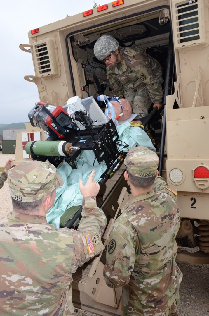 Soldiers testing the intrathoracic pressure regulation therapy, or IPRT, device load it onto an Mine-Resistant Ambush Protected, or MRAP, vehicle at Joint Base San Antonio-Camp Bullis Nov. 7.