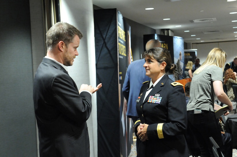 Paul Kelly, left, principal of Elk Grove High School and the 2018 Illinois Principal of the Year meets Brig. Gen. Kris A. Belanger, commanding general of the 85th United States Army Reserve Support Command, during a reception, ahead of the 2018 U.S. Army Leadership Symposium held at Fort Leavenworth, Kansas, November 7-9, 2018.