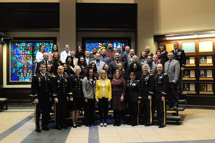 Principals, counselors and educators from around the nation pause for a photo with U.S. Army Soldiers and staff members during the 2018 U.S. Army Leadership Symposium held at Fort Leavenworth, Kansas, November 7-9, 2018.