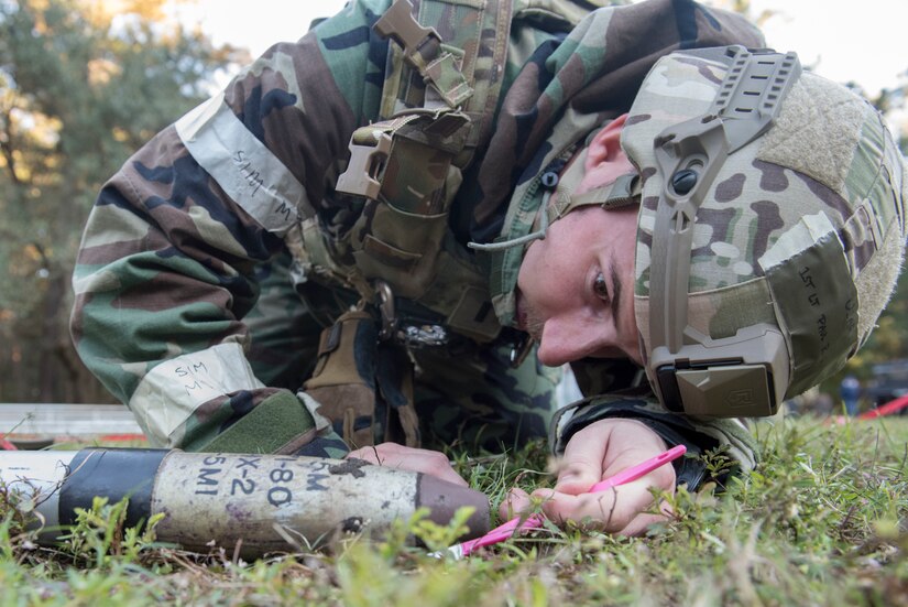 1st Lt. Paul Underwood, 628th Civil Engineer Squadron explosive ordnance disposal flight commander, inspects an unexploded ordnance during an exercise Nov. 16, 2018 at Joint Base Charleston, S.C.To keep the training as realistic as possible, participants from across JB Charleston received the equipment, weapons and specialty uniform items they would use in real-world situations. The simulated scenarios enabled senior base leaders and subject matter experts to ensure the readiness of JB Charleston’s quick response capabilities.