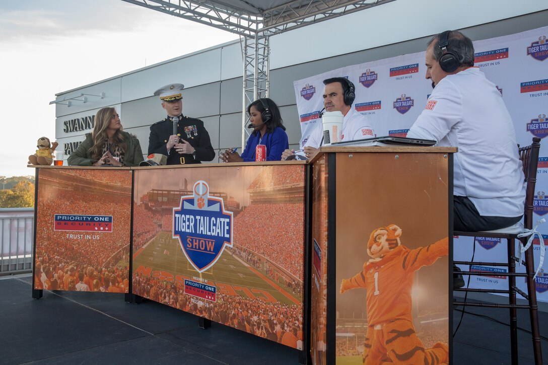 Maj. Trey Kennedy, the officer selection officer of Officer Selection Team Charlotte, speaks with sports reporters of the Tiger Tailgate Show before a Clemson University veteran's appreciation football game in Clemson, South Carolina, Nov. 17, 2018. (U.S. Marine Corps photo by Sgt. Jorge A. Rosales)