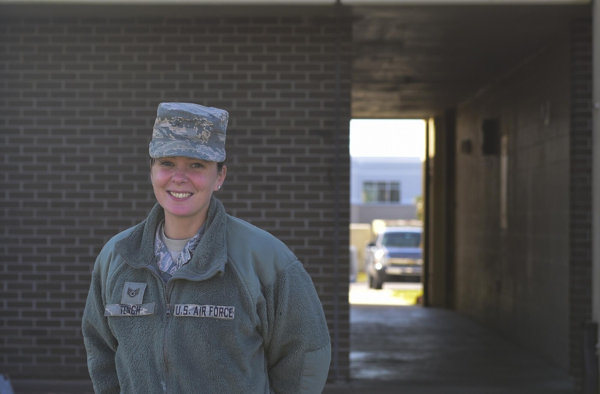 U.S. Air Force Staff Sgt. Candace Tench, 325th Force Support Squadron assistant guest service manager, poses for a photo in front of the dormitory she and her team are restoring at Tyndall Air Force Base, Fla., Nov. 17, 2018. Tench’s goal is to provide Airmen working on the recovery effort with lodging that could ease the stresses of restoring Tyndall. Services specialist, like Tench, normally maintain and operate hotels, restaurants and fitness centers at bases all over the world. This includes bases in deployed locations and can include duties such as managing and directing force support programs, establishing and supervising facilities that provide food and lodging, managing budget for various base services and promoting physical fitness to maintain Air Force unit readiness. (U.S. Air Force photo by Senior Airman Cody R. Miller)