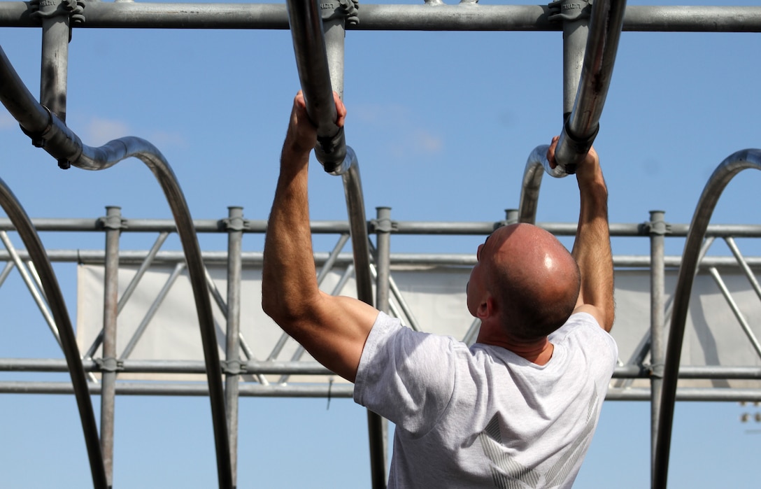 Air Force 1st Lt. John Novotny tackles an obstacle during the first Inter-service Alpha Warrior Final Battle Nov. 17, 2018, Retama Park, Selma, Texas. (U.S. Air Force by Debbie Aragon)