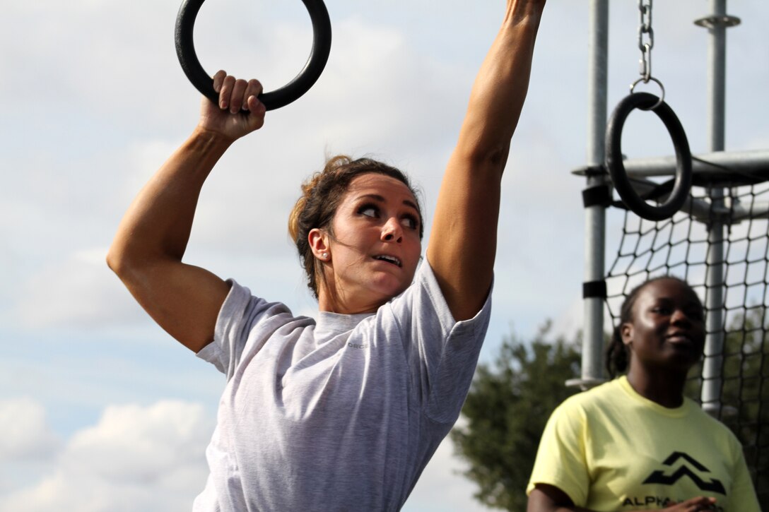 Air Force Senior Airman Stephanie Williams tackles the rings obstacle of the proving rig during the first Inter-service Alpha Warrior Final Battle Nov. 17, 2018, Retama Park, Selma, Texas. (U.S. Air Force photo by Debbie Aragon)