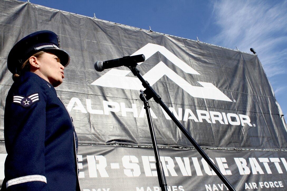 Air Force Bank of the West vocalist Senior Airman Michelle Rajotte sings the national anthem before the first ever Inter-service Alpha Warrior Final Battle Nov. 17, 2018, at Retama Park, Selma, Texas. Air Force won the competition against the Army and Navy. (U.S. Air Force photo by Debbie Aragon)