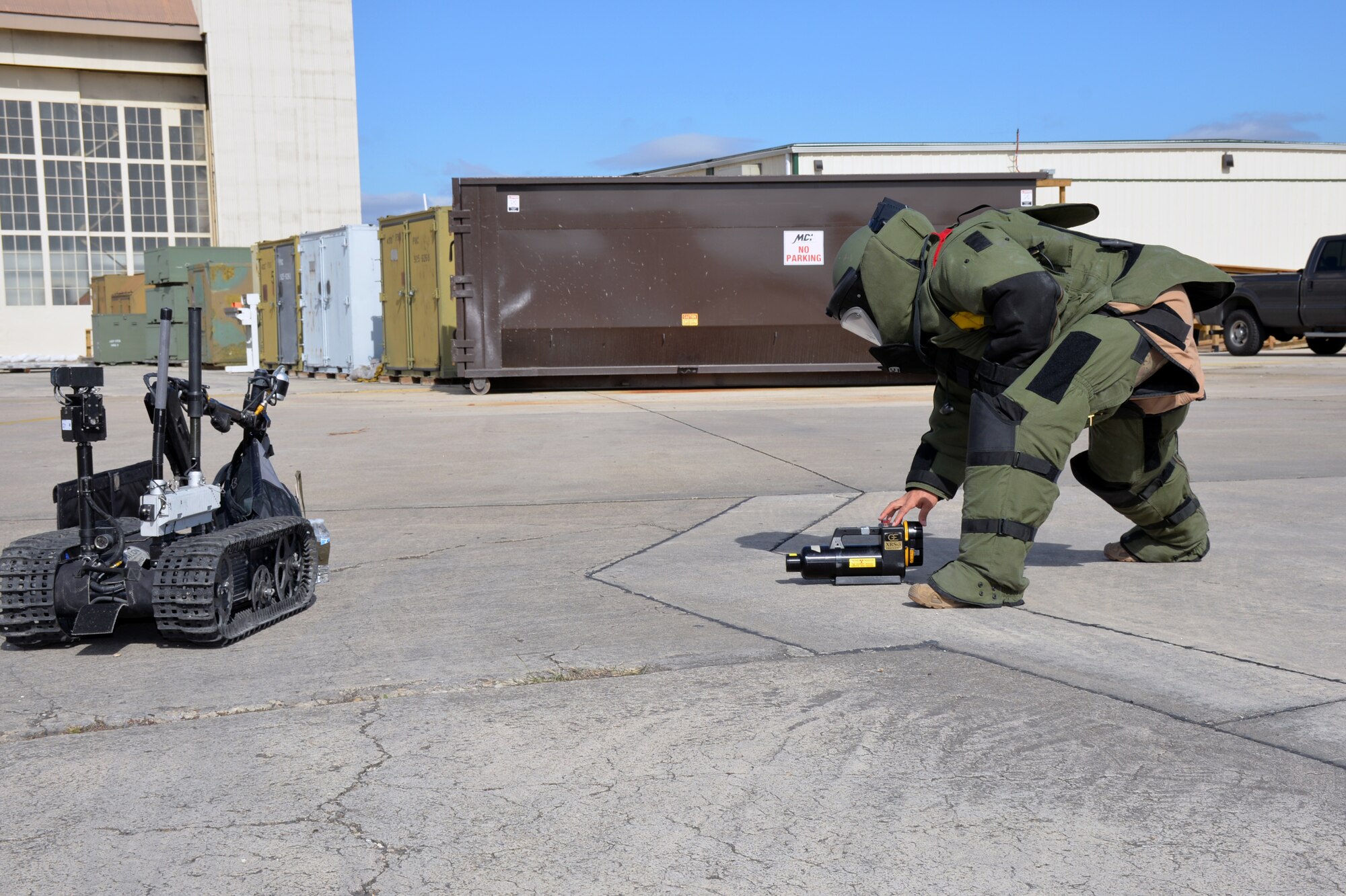 Tech. Sgt. James M. Gonzales, 433rd Civil Engineer Squadron explosive ordnance disposal specialist, sets up a portable X-ray system to inspect a suspicious package held by a Talon explosive ordnance disposal robot during a wing-wide readiness exercise at Joint Base San Antonio-Lackland, Texas Nov. 17, 2018.