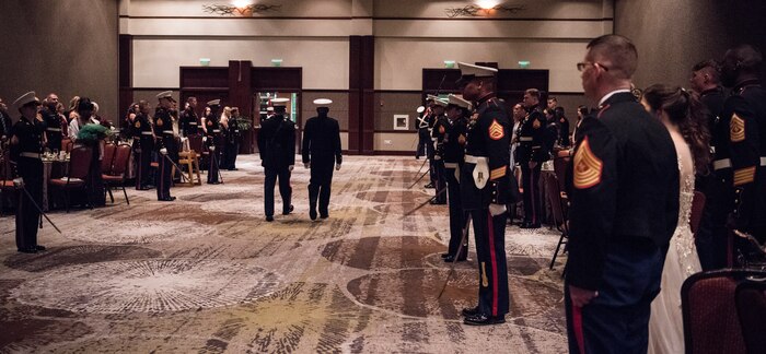 Team Charleston Marines and guests await the arrival of the official party at the annual Marine Corps’ Ball at the Charleston Area Convention Center Nov. 17, 2018, in Charleston, S.C. Retired Marine Corps Col. Arthur Sass, a naval science instructor at Eau Claire High School, delivered the keynote address during the ceremony celebrating the service's 243rd birthday. The Marine Corps was established on Nov. 10, 1775 and its birthday is celebrated with a traditional ball and cake-cutting ceremony.