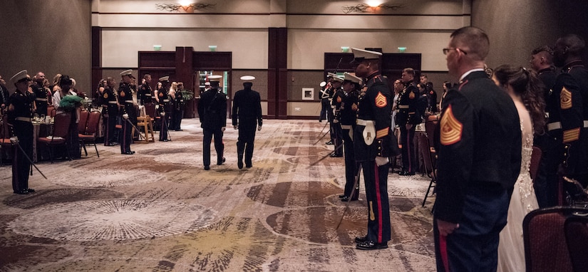 Team Charleston Marines and guests await the arrival of the official party at the annual Marine Corps’ Ball at the Charleston Area Convention Center Nov. 17, 2018, in Charleston, S.C. Retired Marine Corps Col. Arthur Sass, a naval science instructor at Eau Claire High School, delivered the keynote address during the ceremony celebrating the service's 243rd birthday. The Marine Corps was established on Nov. 10, 1775 and its birthday is celebrated with a traditional ball and cake-cutting ceremony.