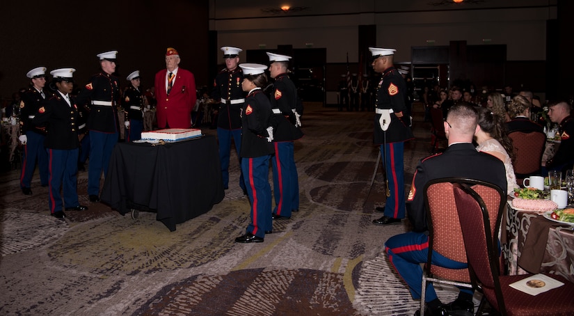 Marines await the beginning of the cake-cutting ceremony at the  Marine Corps’ Ball held at the Charleston Area Convention Center Nov. 17, 2018, in Charleston, S.C. Retired Marine Corps Col. Arthur Sass, now a naval science instructor at Eau Claire High School, delivered the keynote address during the ceremony. The Marine Corps was established on Nov. 10, 1775 and its birthday is celebrated with a traditional ball and cake-cutting ceremony.