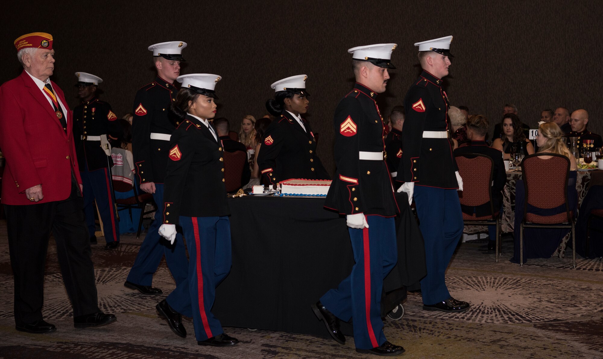 Team Charleston Marines bring in the cake to celebrate the U.S. Marine Corps' 243rd birthday at the annual Marine Corps’ Ball held at the Charleston Area Convention Center Nov. 17, 2018, in Charleston, S.C. Retired Marine Corps Col. Arthur Sass, now a naval science instructor at Eau Claire High School, delivered the keynote address during the ceremony. The Marine Corps was established on Nov. 10, 1775 and its birthday is celebrated with a traditional ball and cake-cutting ceremony.